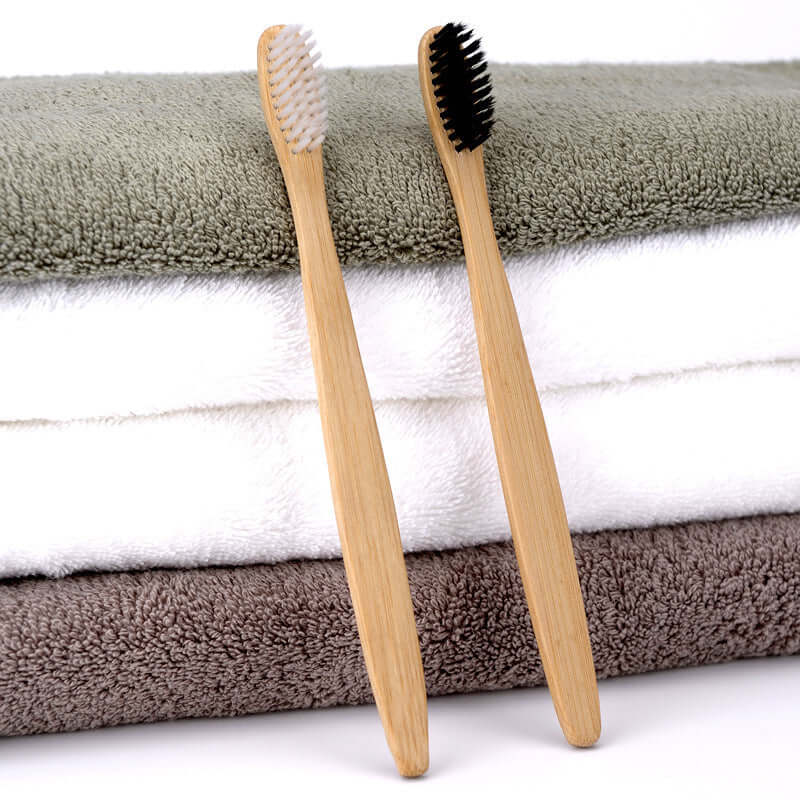 Charcoal bamboo toothbrush with bamboo handle and charcoal bristles for a deep, natural clean