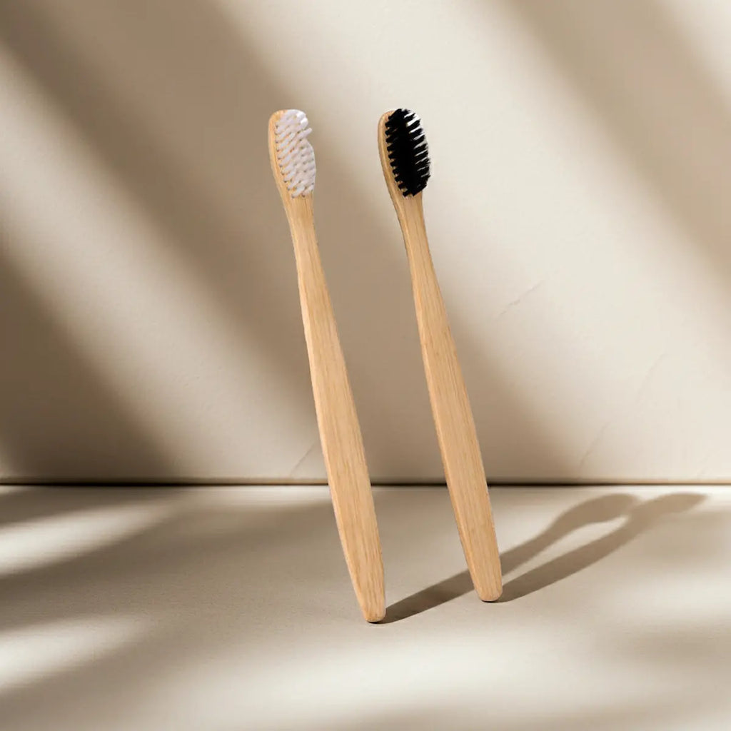 Charcoal bamboo toothbrush with bamboo handle and charcoal bristles for a deep, natural clean
